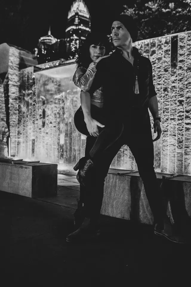 Rodrigo and Wendy in a black and white dip against a city skyline