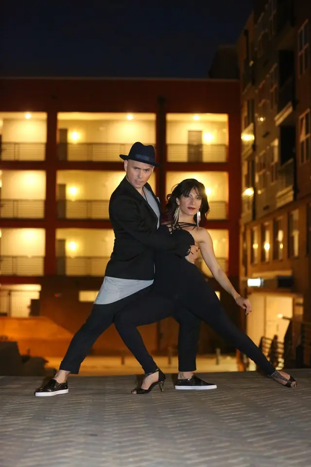 Rodrigo and Wendy dancing on a city street at night